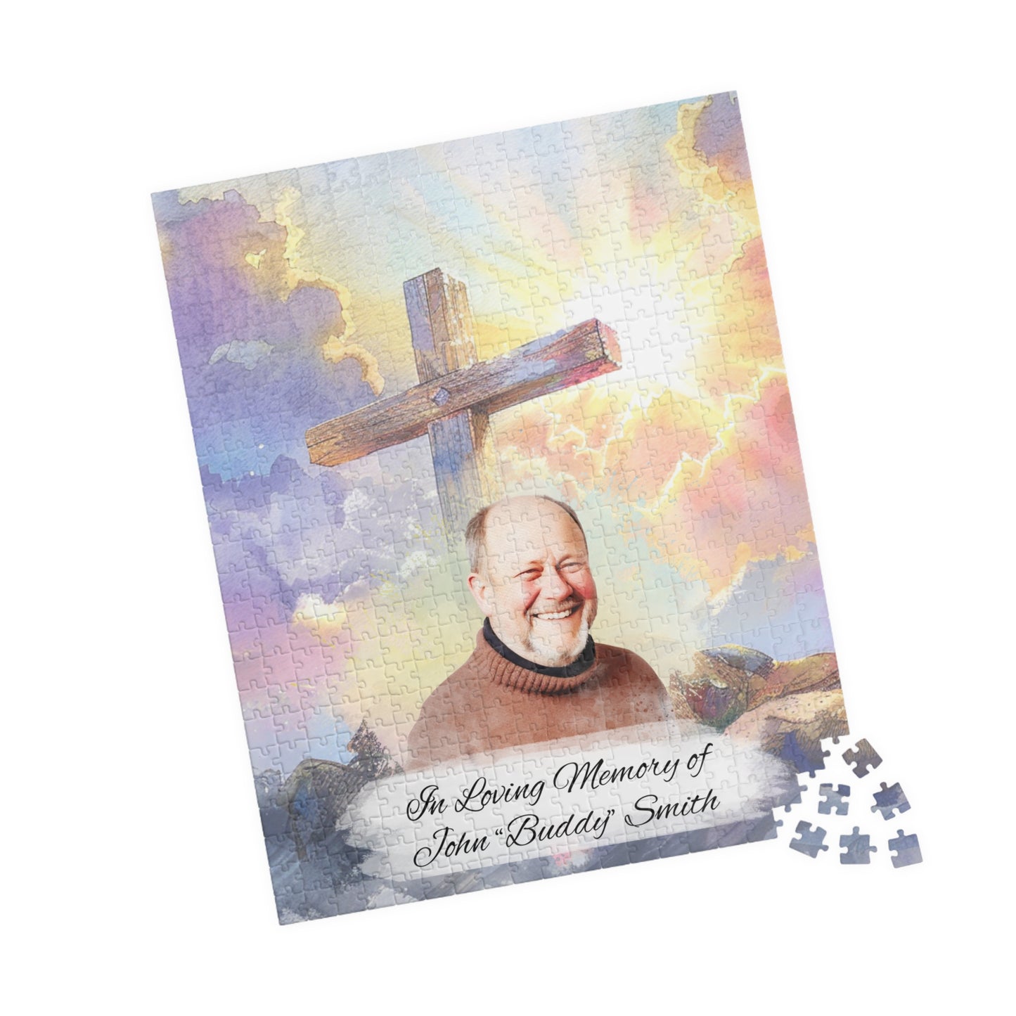 Custom memorial puzzle with a sacred cross keepsake design, featuring a photo of John "Buddy" Smith, personalized with "In Loving Memory of John 'Buddy' Smith," available in 252 or 520 pieces, set against a heavenly sky background with scattered pieces.