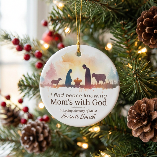 Personalized Christmas ornament with religious design on a decorated tree.