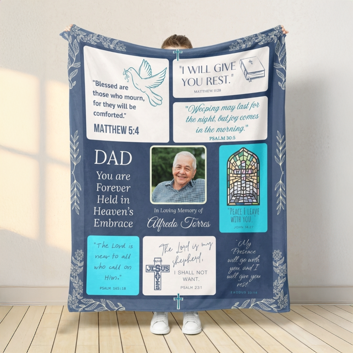Personalized memory blanket with religious text and a photo of a man, displayed indoors.