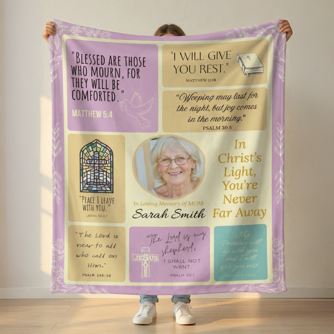 Person holding a personalized Memorial Blanket with religious quotes and a photo of a woman.