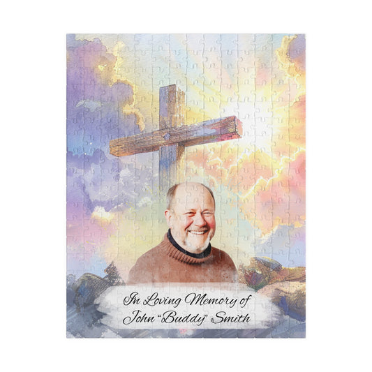 Custom memorial puzzle with a sacred cross keepsake design, featuring a photo of John "Buddy" Smith, personalized with "In Loving Memory of John 'Buddy' Smith," available in 252 or 520 pieces, set against a heavenly sky background with scattered pieces.